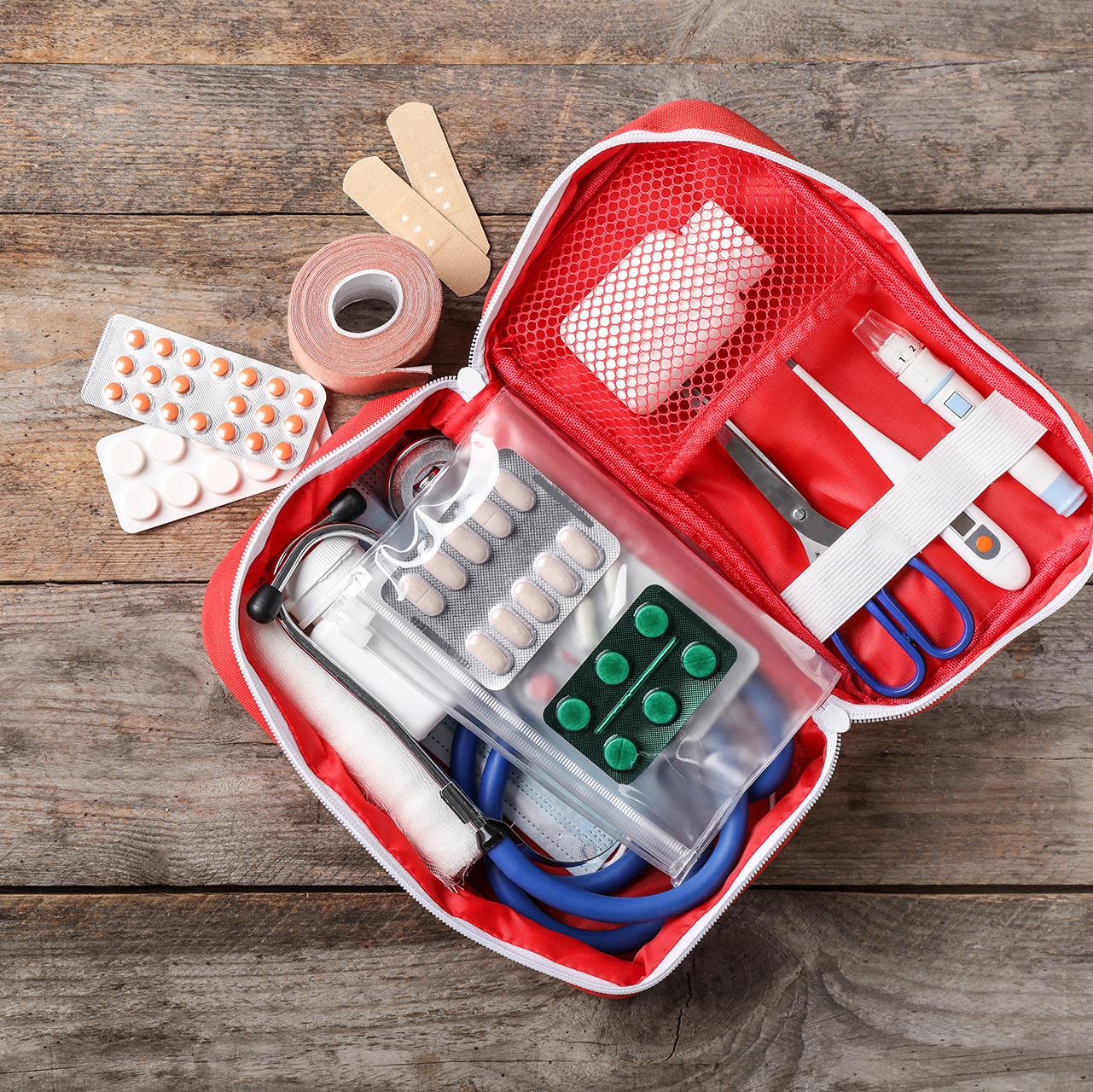 flat-lay-composition-with-first-aid-kit-and-space-for-text-on-wo